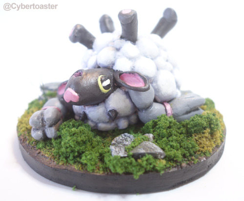 I sculpted a Wooloo rolling in some grass!