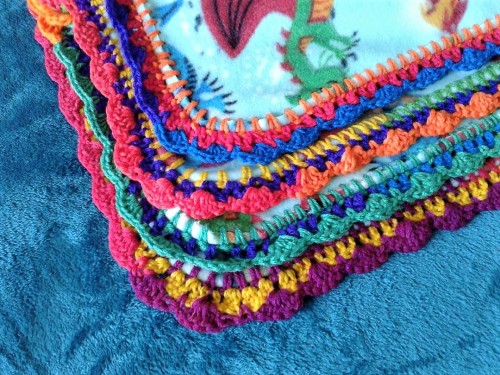  Another fleece blanket with a variegated rainbow yarn in primary colors. I bought a second skein ‘j