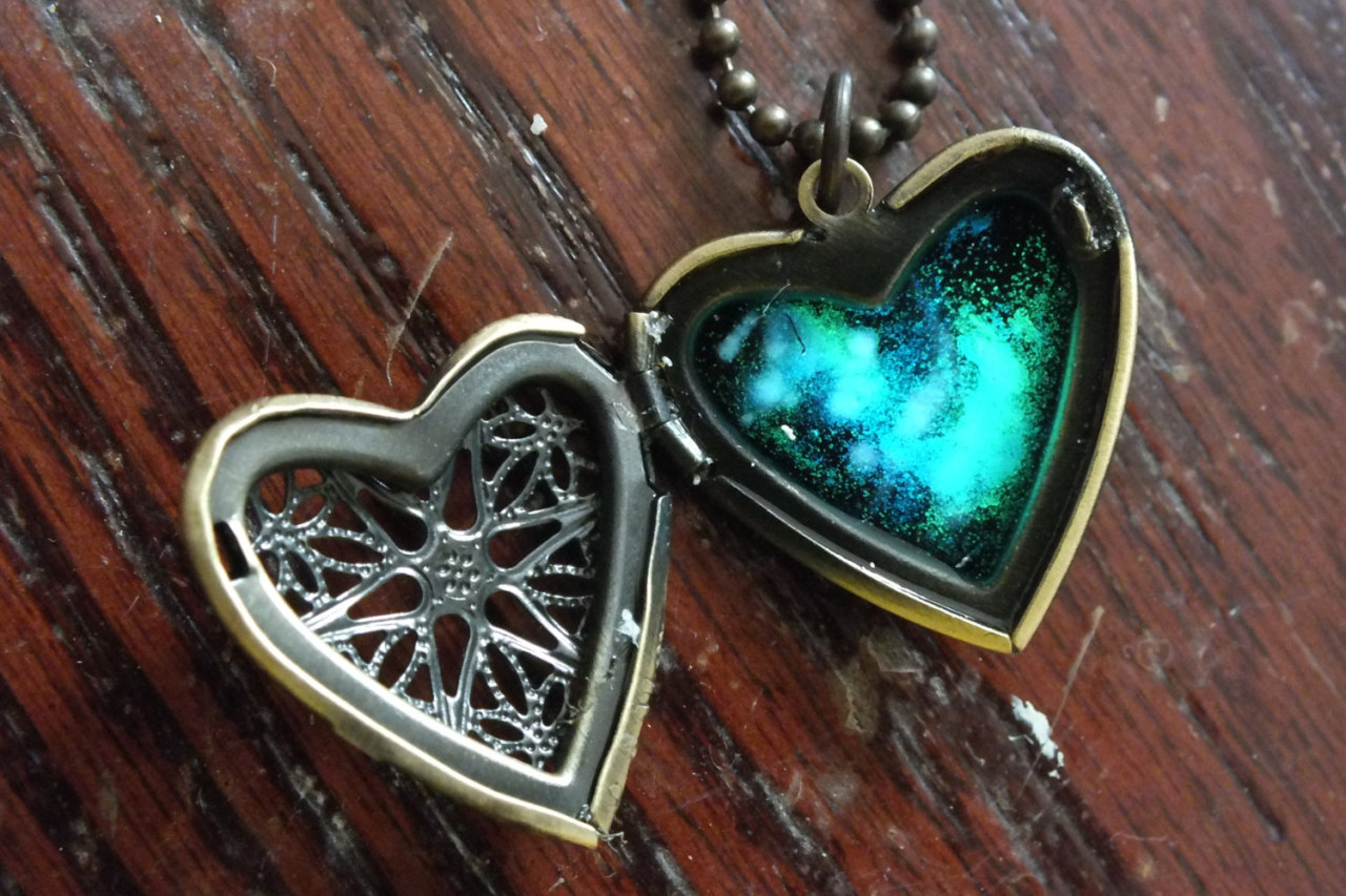 wickedclothes:  Glow In The Dark Galaxy Heart Locket Caged inside of this brass-colored