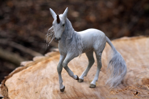 “Demure” is a one of a king unicorn sculpture, made from polymer clay over wire and foil. She is com