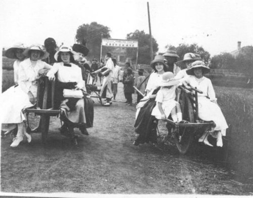 Group of foreign ladies on Chinese wheelbarrows in 1900. Taken by Ivon Arthur Donnelly (1890-1951) i