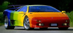 carsthatnevermadeitetc:  Lamborghini Diablo VT, 1999, by Rinspeed. A rainbow-striped Diablo VT by the Swiss customiser/tuner. Whilst it’s tempting to think it might a gay thing I think it is just a design exercise. It also featured custom made 18