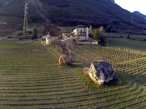 the-gas-station:  Rolling Stones Picture: Last Tuesday, a landslide in Northern Italy produced two huge boulders that barely missed a farmhouse and destroyed a nearby barn as they plowed their way downhill. © Tareom, Source 
