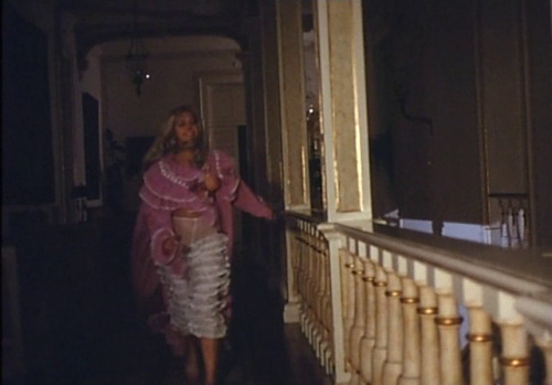 chickswithcandles:Lina Romay as a Gothic gaslit dame running through a dark hallway.