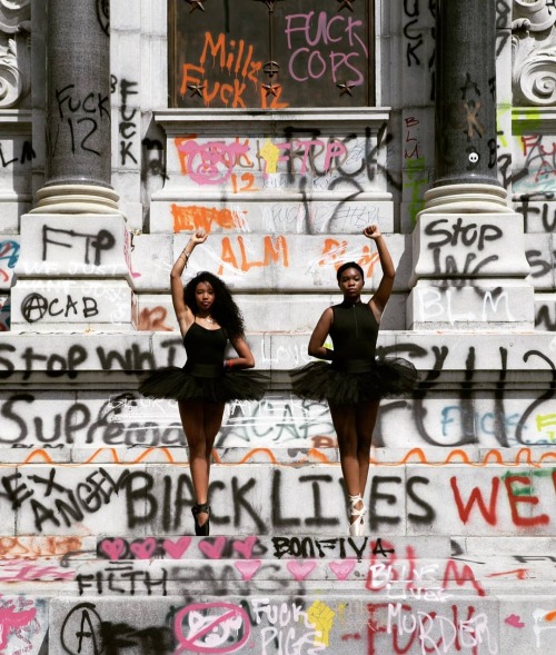 Ballerinas on the defaced monument of Confederate general Robert E. Lee in Richmond, Virginia, on Ju