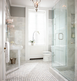 designmeetstyle:  A Grecian marble bath fit for a goddess. A chic bath is wrapped in Grecian marble and grounded with classic honed marble mosaic. Brushed nickel fixtures complete the look. Get the look.