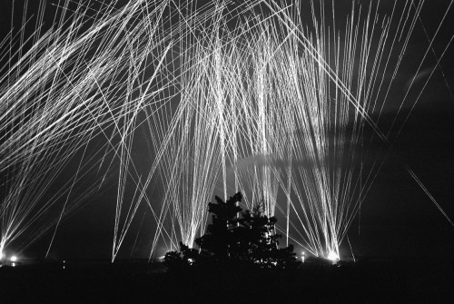 This pattern of anti-aircraft fire provides a protective screen over Algiers at night. The photo, re