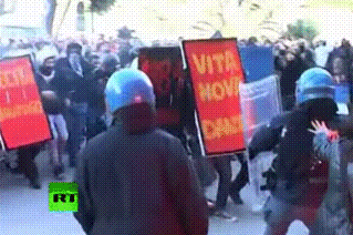 kropotkindersurprise:  transkafka:  combine praxis and theory by beating a cop with a book  These Italian students are way ahead of you[video]