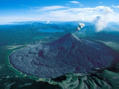 THE VOLCANOES OF KAMCHATKA The 1,250-kilometre long Kamchatka Peninsula is located in the Russian Fa