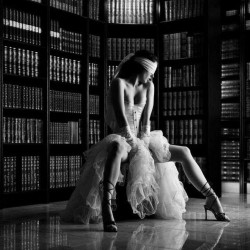 firefly-flashes: “Where are we?” she asked nervously as he guided her to a seat, not removing the blindfold. “Guess,” he said. She took a deep breath, the smell of old books and lemony floor polish making her smile. “The library.” Her hands