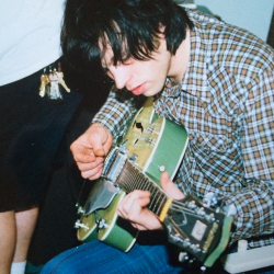 myfavoriteever:  Another oldie I found in a box with first band and Whiskeytown pictures. Who’s guitar??? 