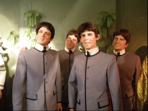 Wax figures closing in to seal your doom: John Travolta, Nic Cage, The Beatles, Julia Roberts, Jim C