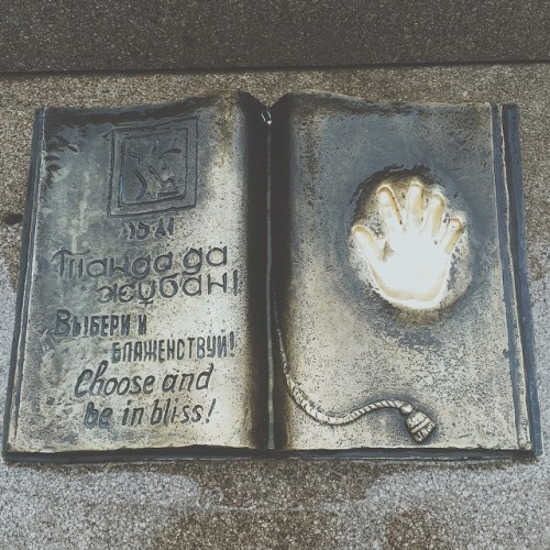 alexlakephoto:A statue of a book at the base of the golden man monument in Almaty, Kazakhstan.The tr