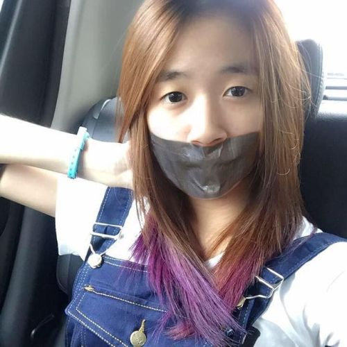 Asian girl fake tape gagged