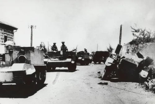 British Universal Carriers Move Past The Wreck Of A Rare French Panhard TOE Colonial Armored Car In Syria,