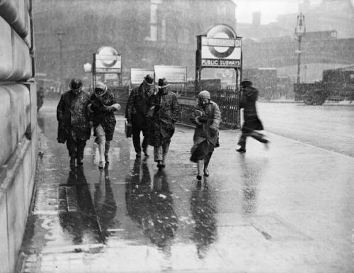 undr:  Fox Photos  Londoners braving the snow and sleet outside Blackfriars tube station. 1933 