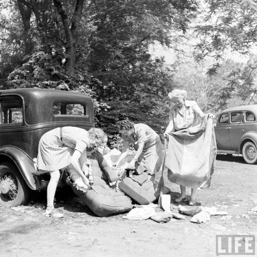 Women repurposing fabric from old car upholstery(Eric Schaal. 1942)