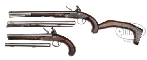 A set of flintlock pistols with spare barrels and detachable shoulder stocks.  Produced by Robert Wo