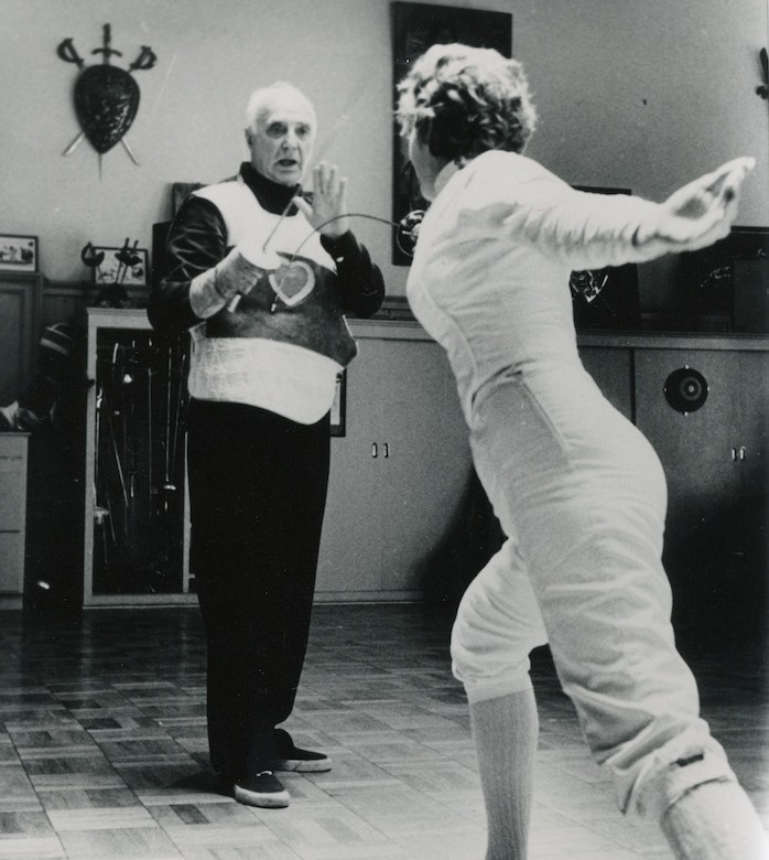 modernfencing: [ID: a foil coach giving a lesson or demonstration with a student.