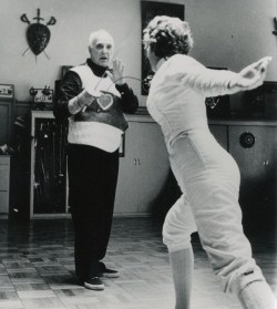 modernfencing: [ID: a foil coach giving a