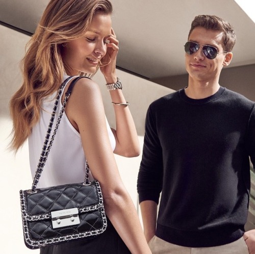 “Michael Kors: Trim is in with our Carine bag. #sunkissed”