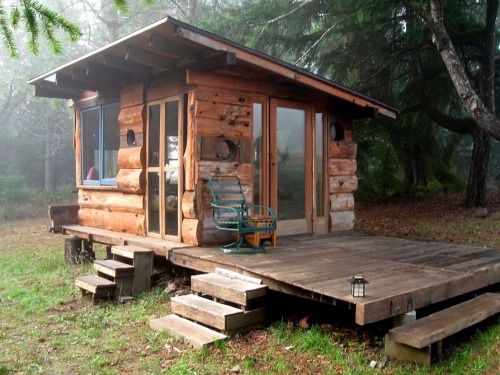 extraterrestrialhitchhiker:  sheltershelter:  riddick09:  񘈨 basic tiny house Off Grid Tiny House Deep In The Carolina Woods Built For 񘈨 – Built from recycled and reclaimed wood. Complete with solar power, natural water source, and a wood stove.