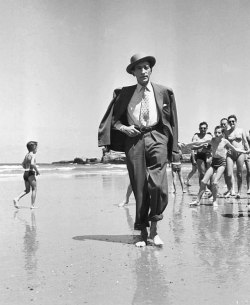 wehadfacesthen:Jean Cocteau on the beach at Biarritz, 1949, photo by Georges Dambier