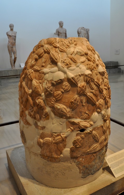 The omphalos in the museum of Delphi. An omphalos is a religious stone artifact, or baetylus. In Gre