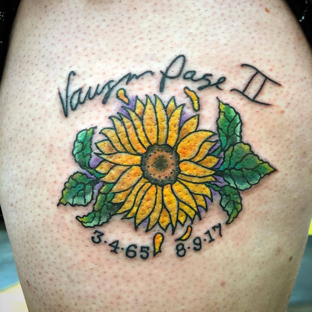 a big grass field  my sister  i got matching sunflower tattoos today