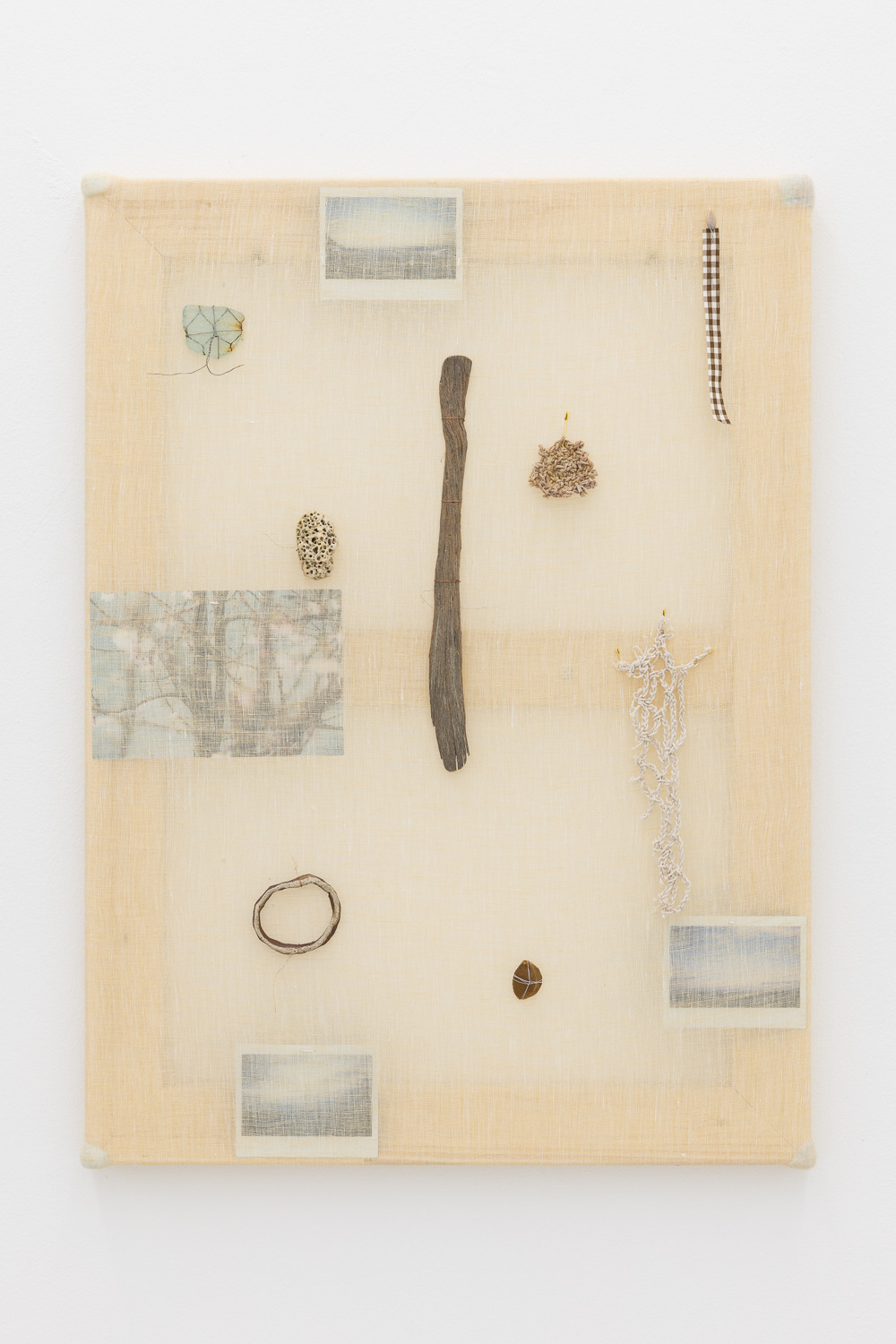 Modern Relics (A white gleam of pearl on the misty sand), 2022
wooden stretcher, muslin, photographs, sea glass, stone, ceramic, driftwood, ribbon, safety pins, crocheted cotton fragments, fruit stone, saree pin, wire and cotton wool
75 x 55 cm