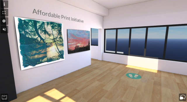 Screenshot of an interior room within a virtual gallery. Grey text at the top of the wall reads: "Affordable Print Initiative". Below are two pieces of artwork included in the affordable print initiative - on the left is a delicate photo print of trees, and on the right is a painting of a blue and pink sunrise sky above the silhouette of bushes.