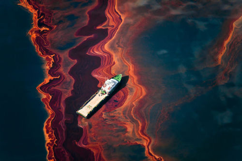 photojojo:  Though it happened nearly 4 years ago, residents of the Gulf Coast continue to witness the aftermath of the 2010 BP oil spill.  Seattle-based photographer Daniel Beltra was able to capture the disaster from the sky, documenting the spill