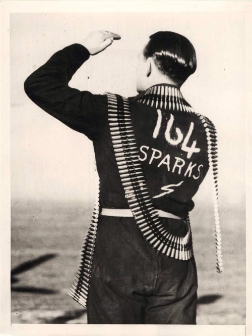 British “Spark”, name given by flyers to those men handling ammunition, shown draped in cartridge be