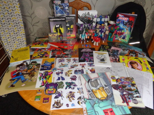 TFN 2017 Haul. Right at the top, the exclusive toy Rune.Beneath her the first two volumes of Stuart 