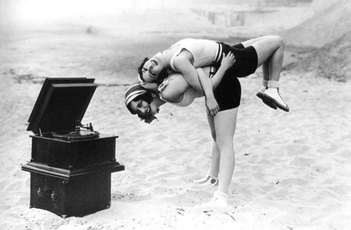 Joan Crawford and Dorothy Sebastian having fun on the beach in Santa Monica, California, in 1927. Se