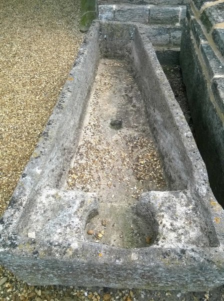 One of the many stone coffins in the graveyard of Crowland Abbey, Lincolnshire, England.