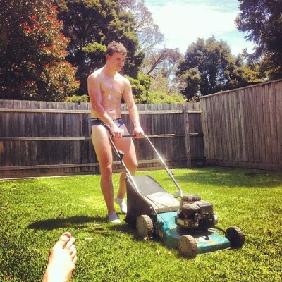 Naked Man Mowing The Lawn