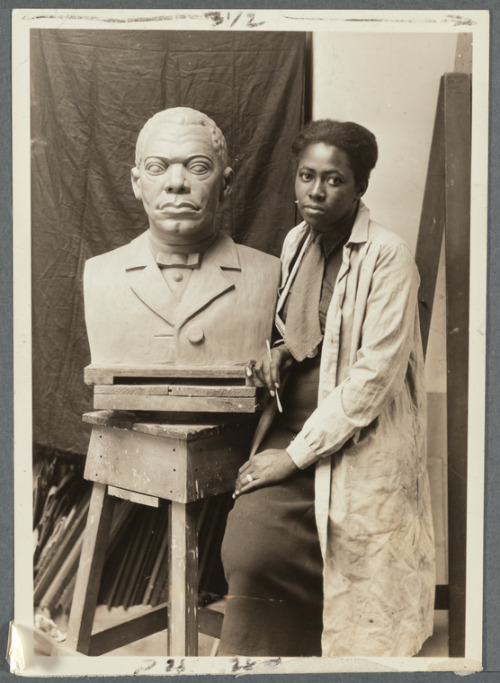 Artist Selma Burke with her portrait bust of Booker T. Washington circa 1935 - 1943(via NYPL)