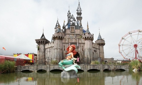 not-emptyspace: culturenlifestyle:  Inside Banksy’s Alternative and Grim Version of Disneyland Welcome to Dismaland, where life isn’t always a fairy tale! Located at the seaside resort of Weston super Mare in the UK, Dismaland is a sinister, dystopian