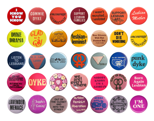 a collection of vintage lesbian protest pins