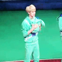 jnumyeon-deactivated20140929:  sehun holding and smelling zitao’s hoodie ヽ(*≧ω≦)ﾉ