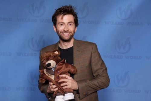 tennydr10confidential: David Tennant being adorkably playful posing with toys.