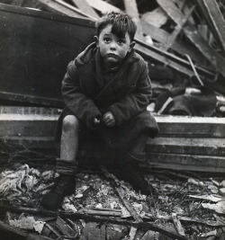 wehadfacesthen:  Boy sitting in the rubble