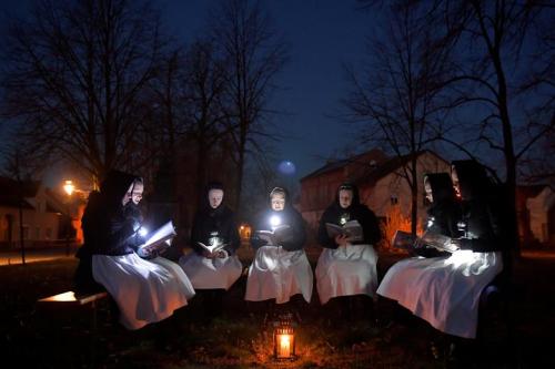 Sorb women celebrating Easter by singing in front of a church in Schleife, April 12, 2020.&gt; P