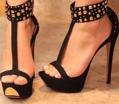 Feet in heels sexy strappy sandals