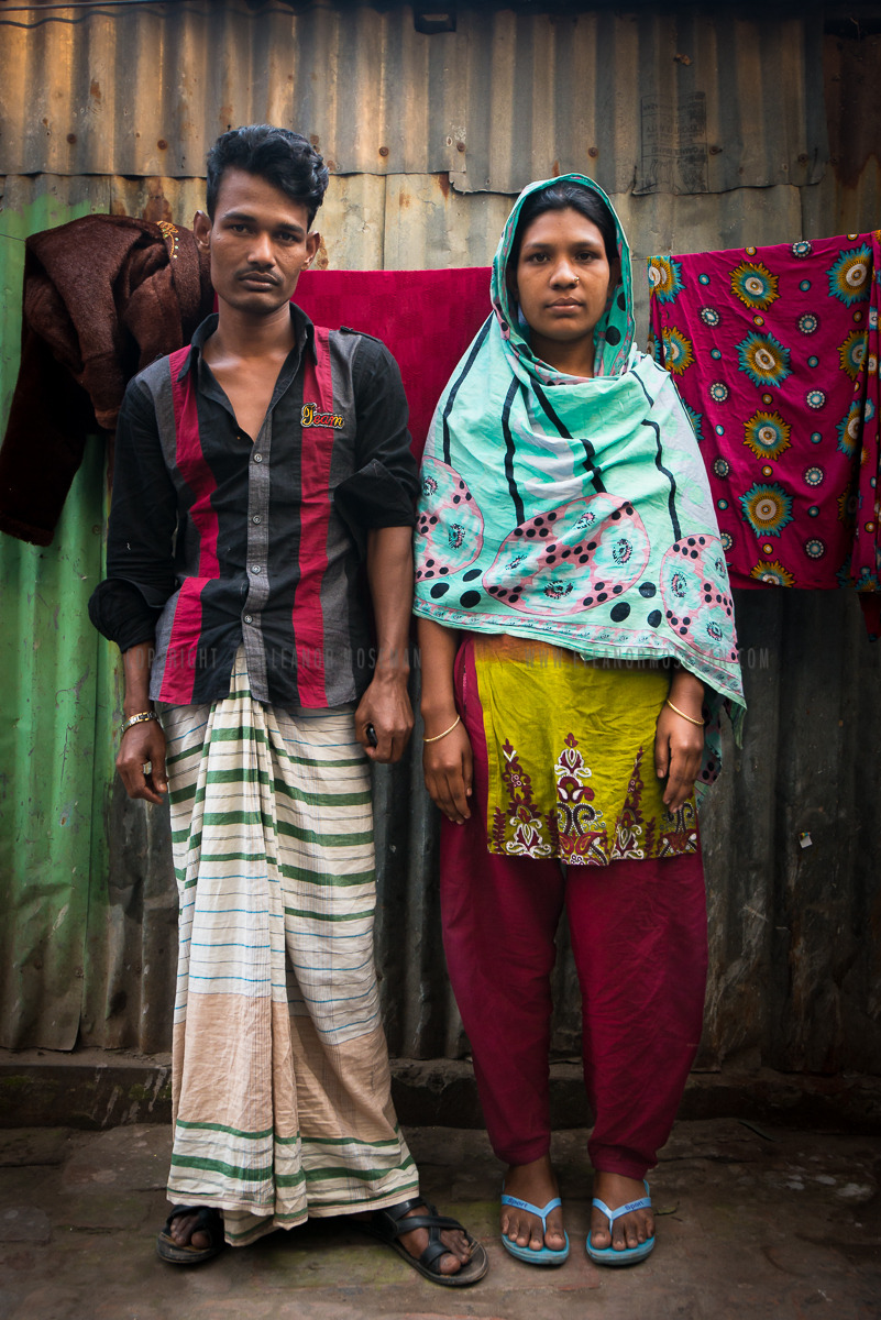 Zorna stands next to her husband in a slum camp developed for garment workers near Dhaka, Bangladesh. February 2014
This young woman is approximately 25 years old and has resided here for the last 10 years. The young couple has one son together that...