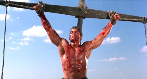 ropermike:Jean-Claude Van Damme in Cyborg (1989). More pics here.A mercenary is crucified on the mas