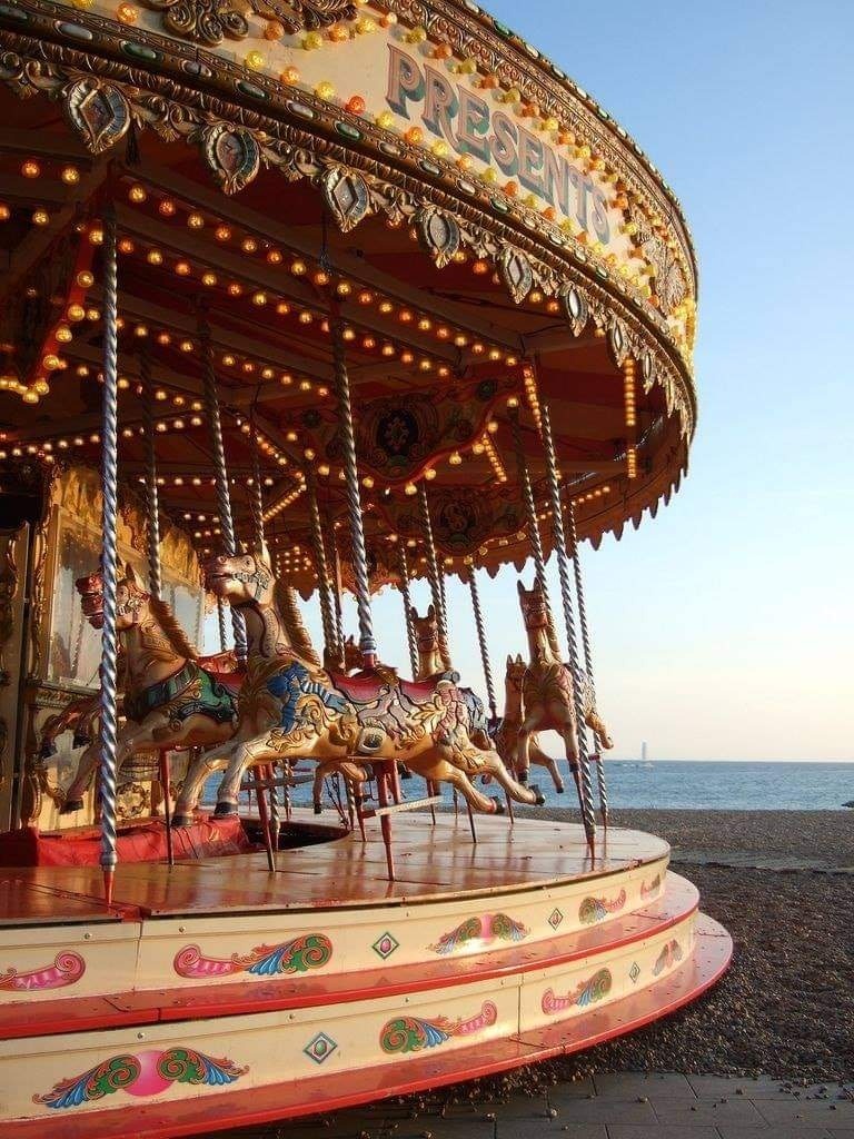 daintyus:“ Carousel on the beach on Brighton, England”