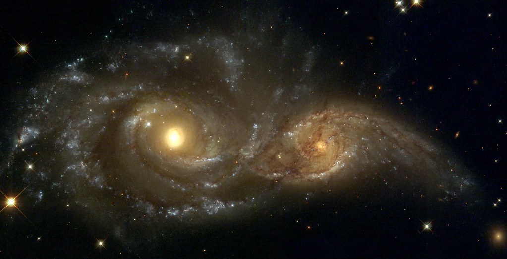 Encounter Between Spiral Galaxies NGC 2207 and IC 2163 by NASA Hubble