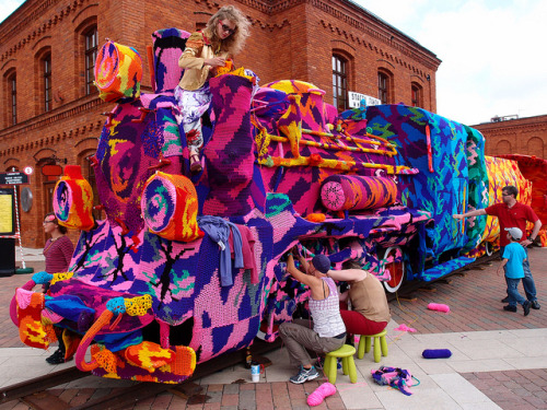  Yarn bomber Olek takes on her biggest project yet, a 4-car locomotive train covered in technicolor camo thread in Lodz, Poland! 